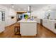 Bright kitchen with white cabinets, hardwood floors, stainless appliances, and a large island perfect for entertaining at 3420 Dawn Ct, Lake Mary, FL 32746