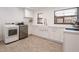 Laundry room featuring modern appliances and bright white cabinets at 3420 Dawn Ct, Lake Mary, FL 32746