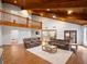 Spacious living room with hardwood floors, beamed ceiling, and open floorplan to the kitchen at 3420 Dawn Ct, Lake Mary, FL 32746