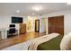 Spacious main bedroom featuring hardwood floors, office space, and an ensuite bath at 3420 Dawn Ct, Lake Mary, FL 32746