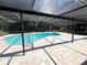 Enclosed backyard pool with clear water and lounge chairs, surrounded by a screened enclosure at 3420 Dawn Ct, Lake Mary, FL 32746