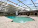 Inviting screened-in pool area with a spacious patio, perfect for relaxation and entertaining at 3420 Dawn Ct, Lake Mary, FL 32746