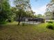 Screened in pool area with pool overlooking spacious yard at 3420 Dawn Ct, Lake Mary, FL 32746