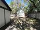 Backyard featuring a storage shed with a trailer and a wooden fence in a fenced yard at 3420 Dawn Ct, Lake Mary, FL 32746