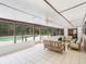Cozy sunroom featuring neutral furnishings and access to the pool area at 3420 Dawn Ct, Lake Mary, FL 32746