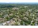 This aerial view showcases the neighborhood's lush greenery, well-maintained homes, and community pool at 356 Oakhurst St, Altamonte Springs, FL 32701