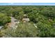 Aerial view of a well-maintained home nestled among mature trees in a quiet neighborhood at 356 Oakhurst St, Altamonte Springs, FL 32701