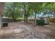 Spacious backyard with mature trees, partial fencing and a shed at 356 Oakhurst St, Altamonte Springs, FL 32701