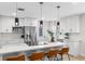 Updated kitchen featuring white cabinetry, stainless steel appliances, a center island with bar seating, and stylish fixtures at 356 Oakhurst St, Altamonte Springs, FL 32701
