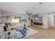 Bright living room with wood floors, contemporary decor, and a large window offering natural light at 356 Oakhurst St, Altamonte Springs, FL 32701