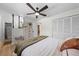 Serene bedroom featuring a ceiling fan, a chest of drawers, and a view of the ensuite bathroom at 356 Oakhurst St, Altamonte Springs, FL 32701