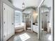 Elegant bathroom with a garden tub, separate glass shower, and tile flooring at 38241 County Road 439, Eustis, FL 32736