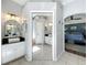Spacious bathroom with dual vanities, walk-in shower, and direct access to the bedroom at 38241 County Road 439, Eustis, FL 32736