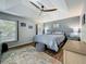 Relaxing bedroom with stylish decor, a tray ceiling, and ample natural light at 38241 County Road 439, Eustis, FL 32736