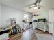 Bright bedroom featuring a ceiling fan, hardwood floors, and plenty of space at 38241 County Road 439, Eustis, FL 32736
