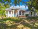 Charming single-story home featuring manicured landscaping, a well-maintained lawn, and a welcoming front entrance at 38241 County Road 439, Eustis, FL 32736
