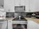 Sleek kitchen featuring stainless steel appliances, elegant backsplash, and modern fixtures for a gourmet cooking experience at 38241 County Road 439, Eustis, FL 32736