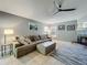 Spacious living room showcasing a comfortable sofa, area rug, and natural light at 38241 County Road 439, Eustis, FL 32736