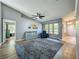Spacious living room with a large window and hardwood floors creating a warm and inviting atmosphere at 38241 County Road 439, Eustis, FL 32736