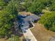 Ariel view of property with large back yard including playset, trampoline and seating area at 39 Lake Dr, Debary, FL 32713