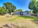 Expansive backyard, showcasing the outdoor area with a play set and trampoline at 39 Lake Dr, Debary, FL 32713