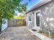 Charming front entrance with a gray exterior, gravel yard, and a classic front door at 39 Lake Dr, Debary, FL 32713