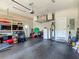 Spacious garage with plenty of storage space, work area, and overhead storage at 39 Lake Dr, Debary, FL 32713