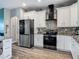 Modern kitchen equipped with stainless steel appliances, granite countertops, and ample cabinet space at 39 Lake Dr, Debary, FL 32713