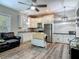 Modern kitchen with stainless steel appliances, granite countertops, and a kitchen island at 39 Lake Dr, Debary, FL 32713