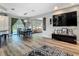Open-concept living area featuring dining table, TV, access to kitchen, and bright natural lighting at 39 Lake Dr, Debary, FL 32713