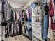 Organized walk-in closet with shelving, hanging racks, drawers, and wood-look flooring for ample storage at 39 Lake Dr, Debary, FL 32713
