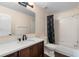 Well-lit bathroom features wood vanity with a large mirror and a shower with a tub at 3904 Woodsfield Ct, Orlando, FL 32822