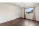Bright bedroom with wood floors, a closet, window, and a decorative chandelier at 3904 Woodsfield Ct, Orlando, FL 32822