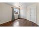 Cozy bedroom with hardwood floors, a chandelier, ample closet space, and bright natural light at 3904 Woodsfield Ct, Orlando, FL 32822