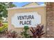 Entrance to the Ventura Place community with lush landscaping and stone accents at 3904 Woodsfield Ct, Orlando, FL 32822