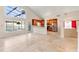Bright open plan living room and kitchen with stainless steel appliances and clear views to the outdoor pool at 3904 Woodsfield Ct, Orlando, FL 32822