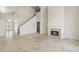 Open-concept living room with ceramic tile flooring, a cozy fireplace, and natural lighting at 3904 Woodsfield Ct, Orlando, FL 32822