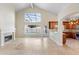 Bright living room with fireplace, high ceilings, and view of the pool area, complemented by tiled floors at 3904 Woodsfield Ct, Orlando, FL 32822
