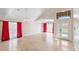 Spacious living area with high ceilings and red curtains at 3904 Woodsfield Ct, Orlando, FL 32822
