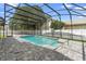 Screened-in pool features ample patio space, perfect for enjoying the outdoors at 3904 Woodsfield Ct, Orlando, FL 32822