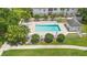 Community pool surrounded by lounge chairs and a privacy fence at 3904 Woodsfield Ct, Orlando, FL 32822