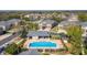Aerial view showcasing the community pool, surrounding landscaping, and exterior architecture at 3917 Pemberly Pines Cir, St Cloud, FL 34769