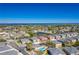 Aerial view of the community highlighting lake views, the community pool, and townhomes at 3917 Pemberly Pines Cir, St Cloud, FL 34769