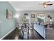 Dining area adjacent to the living room, illuminated by natural light and overhead fixture at 3917 Pemberly Pines Cir, St Cloud, FL 34769