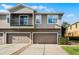 Charming townhome featuring a two-car garage, balcony, and neutral exterior paint at 3917 Pemberly Pines Cir, St Cloud, FL 34769