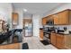Modern kitchen with stainless steel appliances, granite counters, and ample cabinet space at 3917 Pemberly Pines Cir, St Cloud, FL 34769