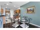 Eat-in kitchen featuring stainless steel appliances and ample granite counter space at 3917 Pemberly Pines Cir, St Cloud, FL 34769
