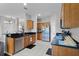 Well-equipped kitchen with stainless steel appliances, granite counters, and tile flooring at 3917 Pemberly Pines Cir, St Cloud, FL 34769