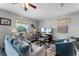Comfortable living room with plush seating, area rug, and bright natural light at 3917 Pemberly Pines Cir, St Cloud, FL 34769
