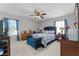 Comfortable main bedroom featuring natural light, ceiling fan, and classic decor at 3917 Pemberly Pines Cir, St Cloud, FL 34769